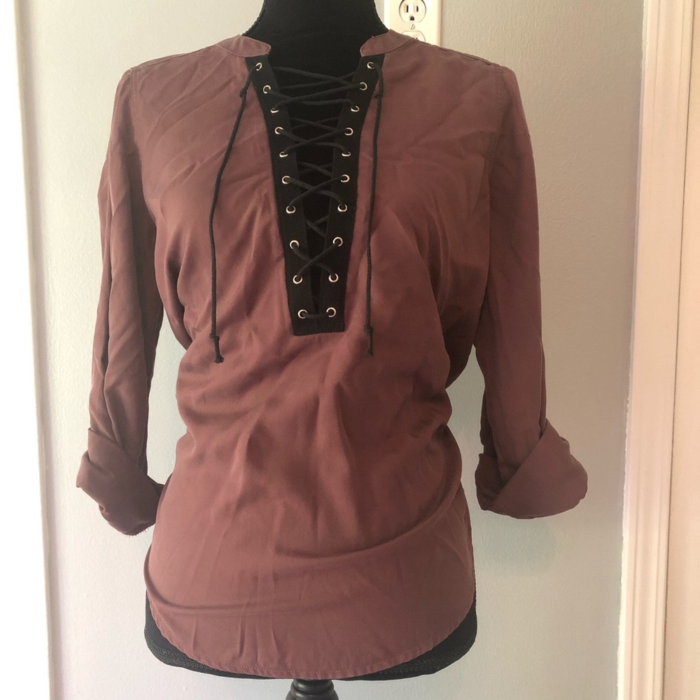 Plum colored shirt with v-neck. Never worn.